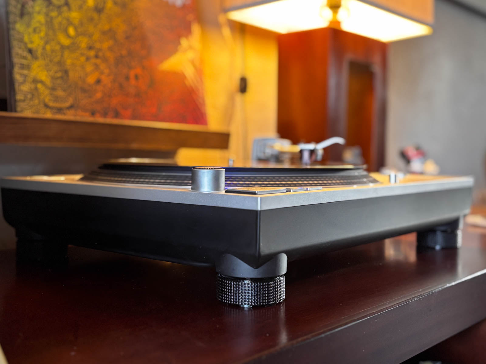 SpinCandy feet installed on a Technics SL-1200 turntable. Side view showing deck stance and classic knurled style.